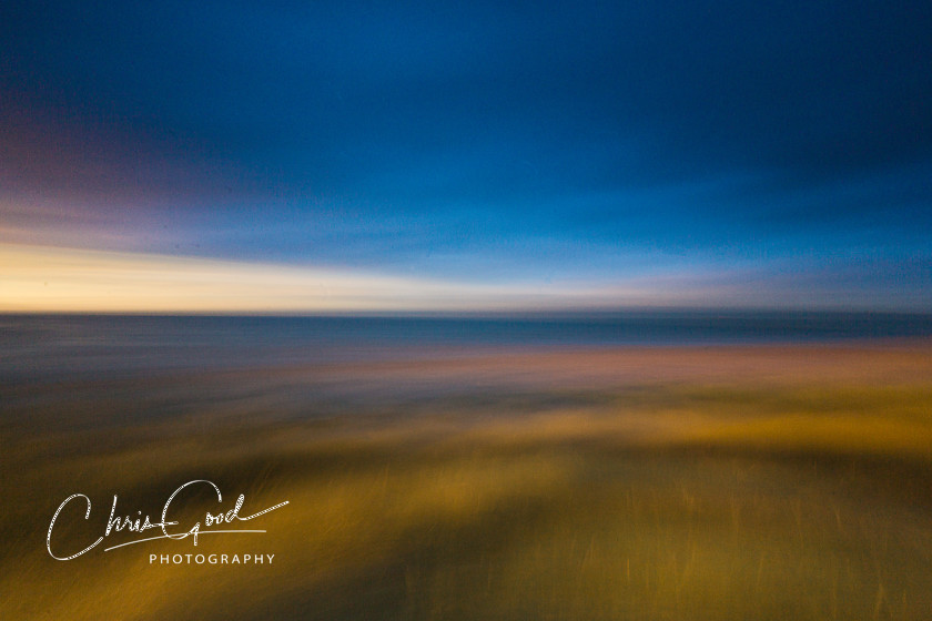 Sunset by the Sea 
 ICM image taken on the dunes at Bamburgh in Northumberland on a beautiful summers evening. 
 Keywords: Bamburgh, ICM, Sunset, Long Exposure, Vibrant, Intentional Camera Movement,
